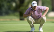 Jacques Kruyswijk of South Africa studies his shot on the 16th green on day one of the Est...