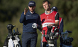 Laurie Canter of England talks with his caddie on the 11th hole during the Estrella Damm N...