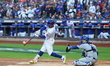 Francisco Lindor #12 of the New York Mets singles during the first inning in Game 5 of the...