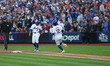 Francisco Lindor #12 of the New York Mets singles during the first inning in Game 5 of the...