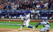 Francisco Lindor #12 of the New York Mets triples during the third inning in Game 5 of the...