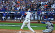 New York Mets' Starling Marte #6 doubles during the first inning in Game 5 of the baseball...