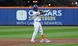 New York Mets' Starling Marte #6 doubles during the first inning in Game 5 of the baseball...