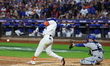 New York Mets' Starling Marte #6 doubles during the third inning in Game 5 of the baseball...