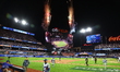 The New York Mets celebrate with fireworks after the team's 12-6 victory in Game 5 of the...