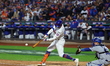 Brandon Nimmo #9 of the New York Mets singles during the third inning in Game 5 of the bas...