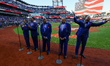 The Temptations sing the National Anthem on the field before Game 5 of a baseball NL Champ...
