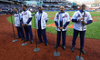 The Temptations sing the National Anthem on the field before Game 5 of a baseball NL Champ...