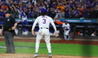 Jesse Winker #3 of the New York Mets scores during the LOREM inning in Game 5 of the baseb...