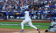 Pete Alonso #20 of the New York Mets hits a home run during the first inning in Game 5 of...