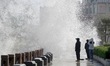 Tourists watch waves at the seaside in Yantai, China, on October 19, 2024. 