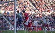 Bristol City goalkeeper Max O'Leary punches clear under pressure from Middlesbrough's Emma...