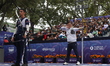 Woojin Kim of Korea and Thomas Chirault of France compete during the Men's recurve quarter...