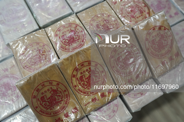 An official of the Narcotics Control Board displays a confiscated 154 kilograms of heroin hidden in their van to be smuggled from Thailand's... by Anusak Laowilas/NurPhoto