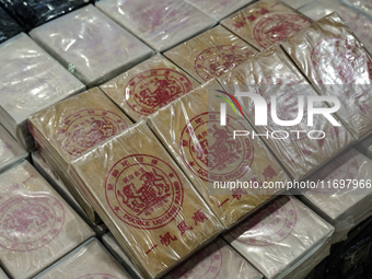 An official of the Narcotics Control Board displays a confiscated 154 kilograms of heroin hidden in their van to be smuggled from Thailand's... by Anusak Laowilas/NurPhoto