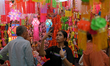 People shop for lanterns at a market ahead of the Hindu festival of Diwali in Mumbai, Indi...