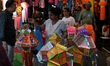 People shop for lanterns at a market ahead of the Hindu festival of Diwali in Mumbai, Indi...