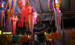 A man arranges a lantern at a market ahead of the Hindu festival of Diwali in Mumbai, Indi...