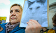 Protesters are seen outside city hall rallying against conditions in cat shelters in Warsa...