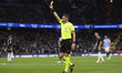 Referee Maurizio Mariani shows a yellow card to Angelo Preciado #17 of AC Sparta Praha dur...