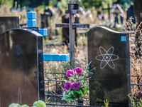 Tombstone in the Slavutich cemetery engraved with the atom symbol means a dead in the Chernobyl accident, Ukraine, on August 25, 2014. The a...