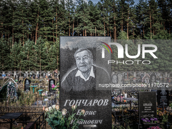 Tombstone engraved with the face of a engineer in the Chernobyl nuclear plant in the cemetery of Slavutich city, Ukraine, on August 25, 2014...