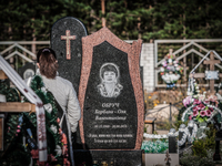 Visitor in the cemetry of Slavutich, city of the workers in Chernobyl nuclear plant, Ukraine, on August 25, 2014.  The Chernobyl disaster wa...