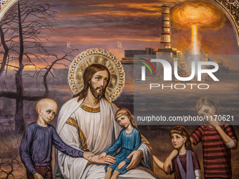 Detail of a painting in the church of Slavutich with Jesuschrist with children and Chernobyl nuclear reactor explosion in background, on Aug...
