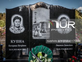 Tombstone engraved with the face of two workers in the Chernobyl nuclear plant in the cemetery of Slavutich city, Ukraine, on August 25, 201...