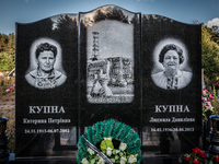 Tombstone engraved with the face of two workers in the Chernobyl nuclear plant in the cemetery of Slavutich city, Ukraine, on August 25, 201...