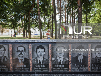 Engraved stone monument in Slavutich in memory of the liquidators who died during cleaning up works after the Chernobyl nuclear power plant...