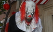 Killer clowns, balloons, and circus bigtop colors stand out outside an Upper East Side tow...