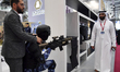 Visitors look at exhibits at the 15th edition of the Milipol Qatar 2024 Exhibition and Con...