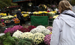 A stand with flowers and candles is next to the Rakowicki Cemetery during preparations for...