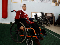 Disabled Palestinian volleyball of Women's a participates in Exercise a in Club Deir al-Balah in the central Gaza Strip on May 21, 2014. (