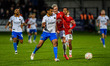 Matty Lund of Salford City FC is tackled by Shrewsbury Town FC's Malvind Benning during th...