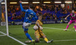Jamie Searle #20 (GK) of Forest Green Rovers F.C. makes a save from Ryan Rydel #23 of Stoc...