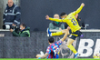 Number 12, Daniel Munoz of Crystal Palace, and number 8, Joao Gomes of Wolves, tussle on t...