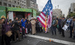 An Iranian cleric burns the U.S. flag outside the former U.S. embassy during an anti-U.S....