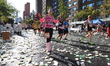 Runners trudge up First Avenue at Mile 16 of the New York City Marathon in New York City,...
