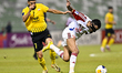 Mehdi Lamouchi of Sepahan SC battles for the ball with Khaled Ebraheim Aldhanhani of Sharj...