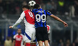 Ben White of Arsenal and Mehdi Taremi of Inter Milan battle for the ball during the Champi...