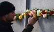 Flowers at Berlin Wall Memorial after the commemoration ceremony marking the 35th annivers...