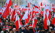 People take part in marking the 106th independence celebration in Warsaw, Poland on 11 Nov...