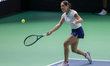 Monica Niculescu of Romania plays a forehand during the Billie Jean King Cup match between...