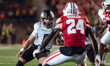 Oregon quarterback Dillon Gabriel #8 scrambles against the Wisconsin Badgers at Camp Randa...