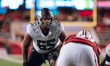 Oregon offensive lineman Marcus Harper II #55 looks at the Wisconsin Badgers defense befor...