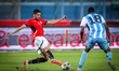 Taher Mohamed of the Egypt team battles for possession with Lebogang Ditsele of the Botswa...