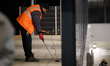 A worker is seen with a light meter on a train platform in Warsaw, Poland on 20 November,...