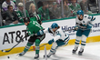 Timothy Liljegren #37 of the San Jose Sharks and Jamie Benn #14 of the Dallas Stars battle...